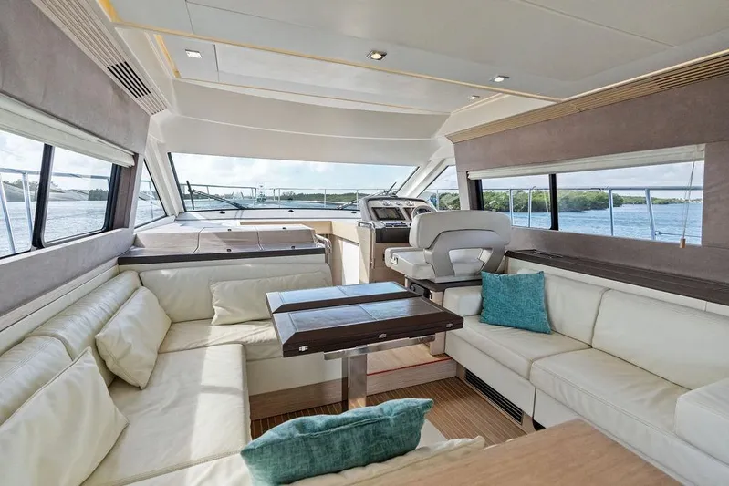  Yacht Photos Pics Luxurious interior of 2018 Monte Carlo MC 35 yacht with plush seating and scenic windows.