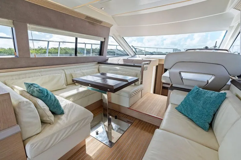  Yacht Photos Pics Luxurious interior of 2018 Monte Carlo MC 35 yacht with plush seating and elegant decor.