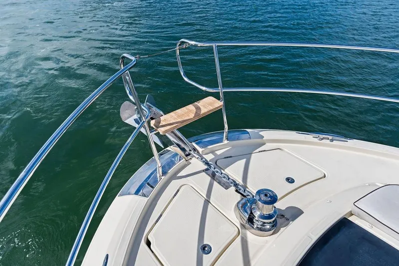  Yacht Photos Pics Bow of 2018 Monte Carlo MC 35 yacht with anchor and railing on water.