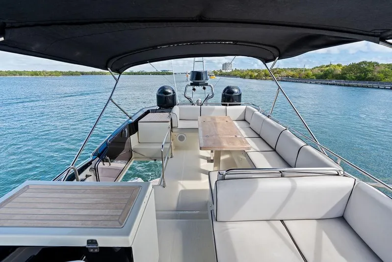  Yacht Photos Pics Luxurious 2018 Monte Carlo MC 35 yacht with spacious seating and scenic water view.