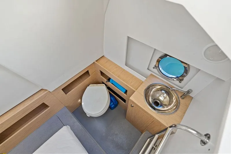  Yacht Photos Pics Compact bathroom in 2018 Monte Carlo MC 35 yacht with toilet and sink.