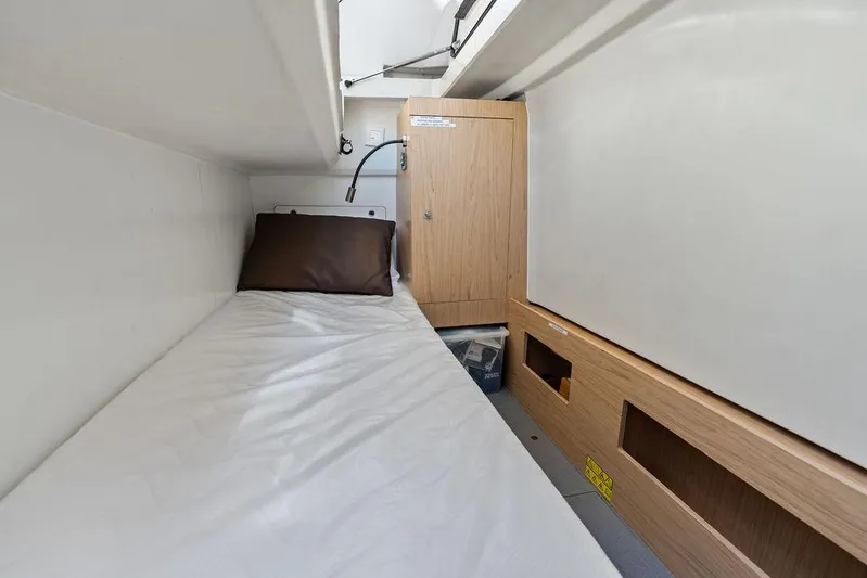  Yacht Photos Pics Compact cabin interior of 2018 Monte Carlo MC 35 yacht with bed and storage.