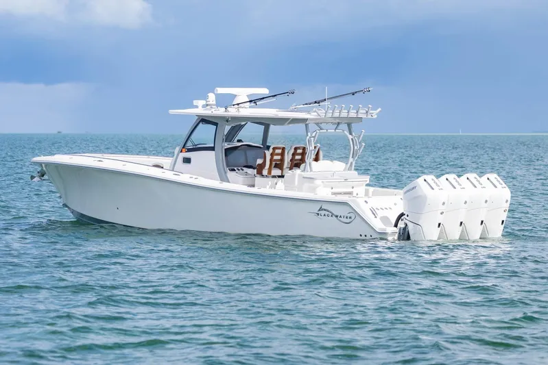 Big B Yacht Photos Pics 2024 Blackwater 43 Sportfish boat on open water, featuring multiple outboard engines.