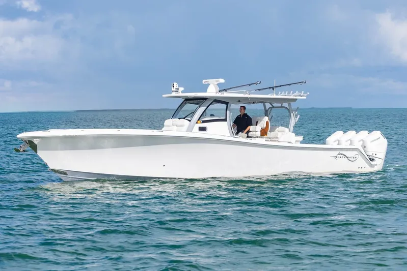 Big B Yacht Photos Pics 2024 Blackwater 43 Sportfish boat cruising on open water under a clear sky.