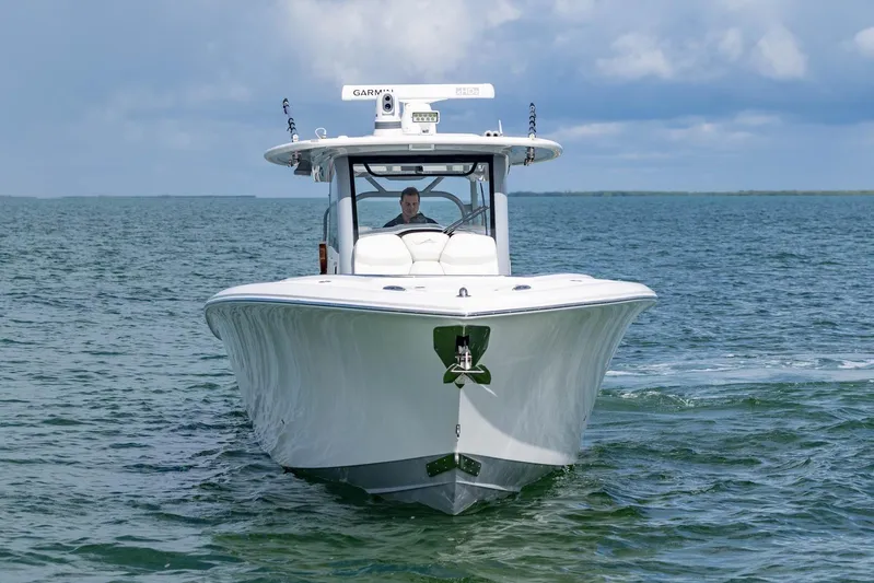 Big B Yacht Photos Pics 2024 Blackwater 43 Sportfish boat cruising on open water under a cloudy sky.