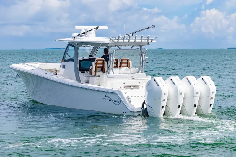 Big B Yacht Photos Pics 2024 Blackwater 43 Sportfish boat cruising on open water with four powerful engines.
