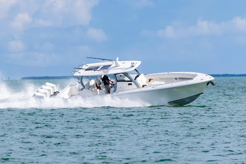Big B Yacht Photos Pics 2024 Blackwater 43 Sportfish boat cruising on open water, showcasing speed and elegance.