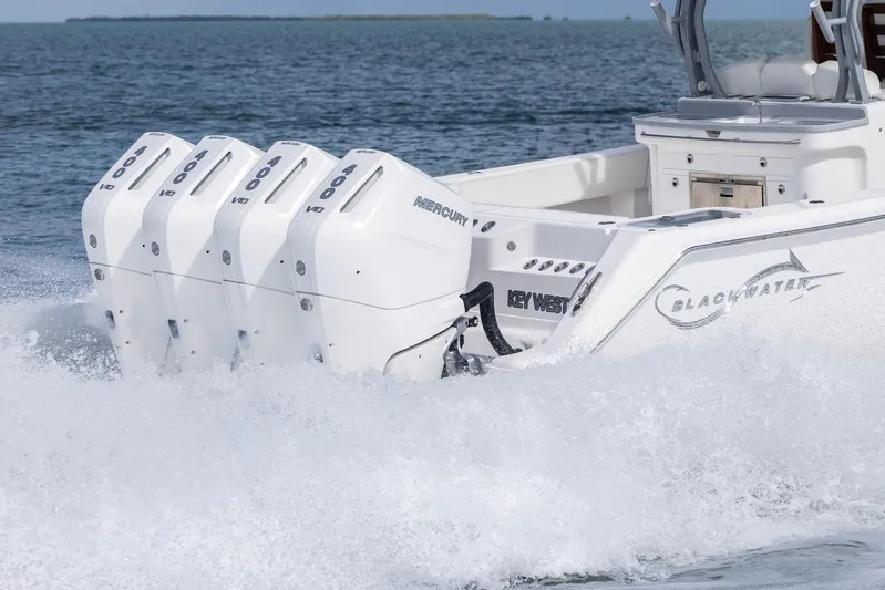 Big B Yacht Photos Pics 2024 Blackwater 43 Sportfish boat with four powerful Mercury outboard engines on the ocean.
