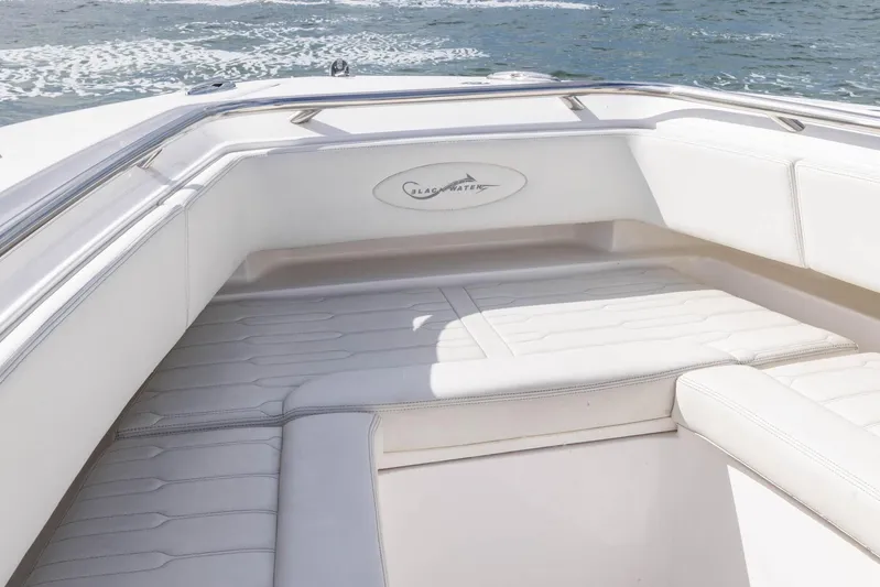 Big B Yacht Photos Pics 2024 Blackwater 43 Sportfish boat interior with white cushioned seating.