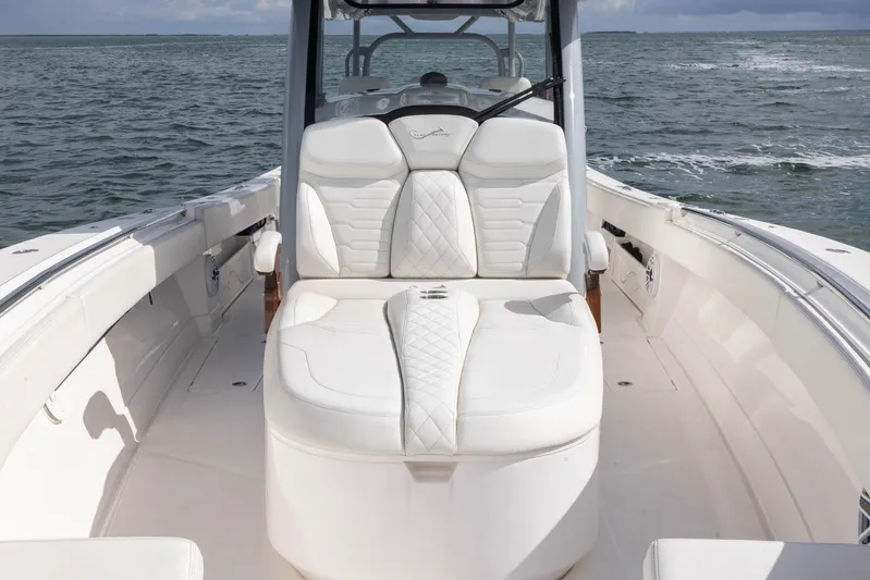 Big B Yacht Photos Pics 2024 Blackwater 43 Sportfish boat with luxurious white seating on open water.