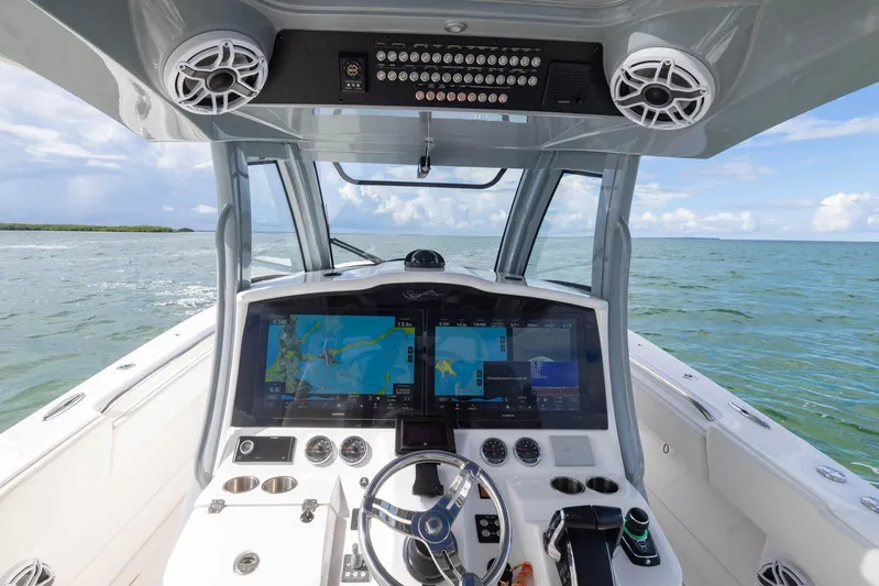 Big B Yacht Photos Pics 2024 Blackwater 43 Sportfish helm with advanced navigation screens on open water.