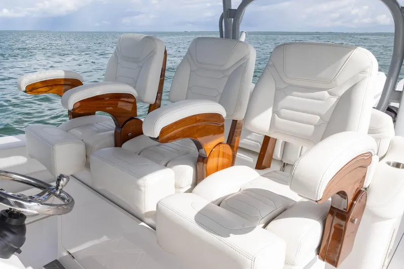 Big B Yacht Photos Pics Luxurious seating on 2024 Blackwater 43 Sportfish boat, featuring elegant white leather and wood accents.