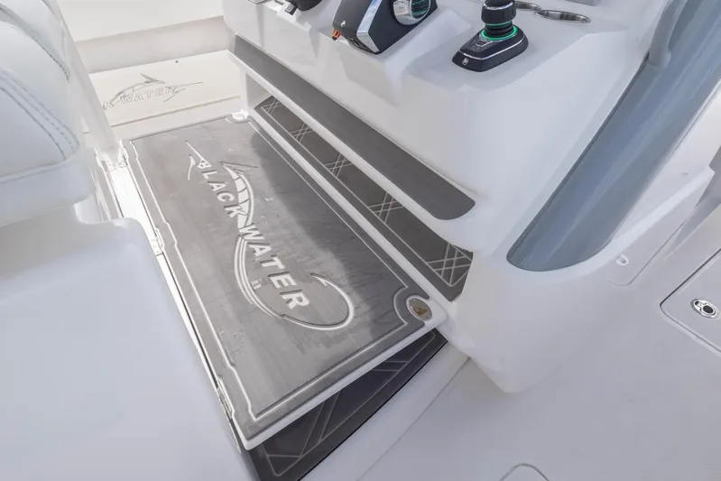 Big B Yacht Photos Pics 2024 Blackwater 43 Sportfish boat interior with branded flooring and control panel.