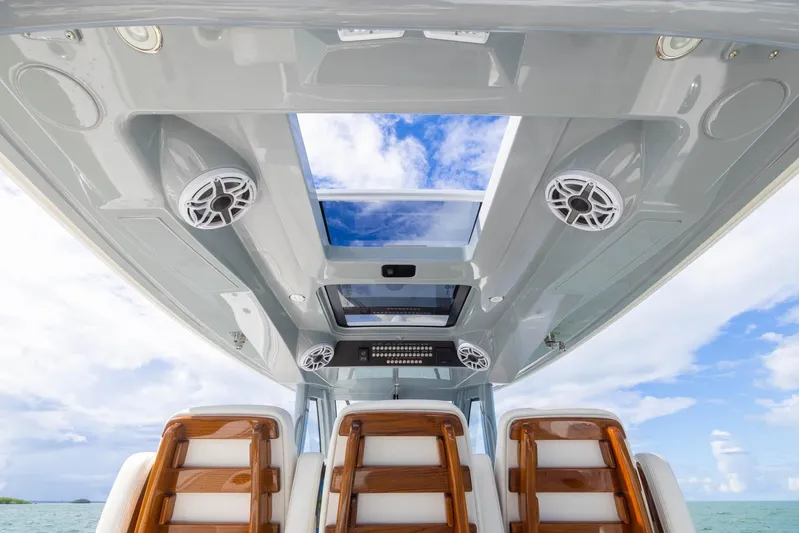 Big B Yacht Photos Pics 2024 Blackwater 43 Sportfish boat interior with skylight and speakers, showcasing luxury design.