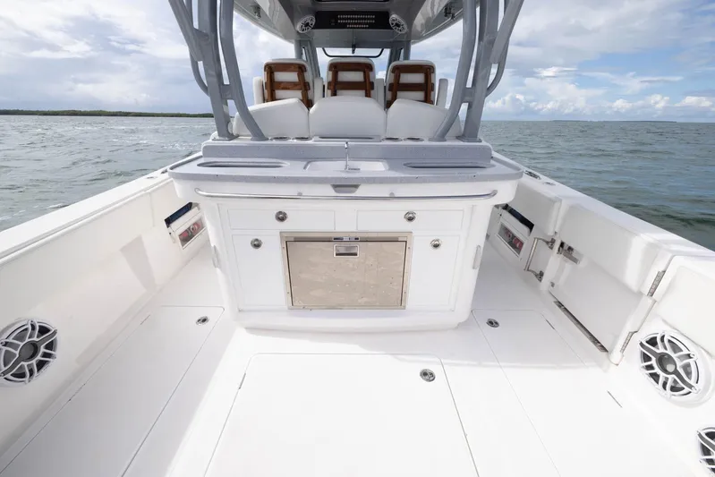 Big B Yacht Photos Pics 2024 Blackwater 43 Sportfish boat deck with seating and storage, ocean view.