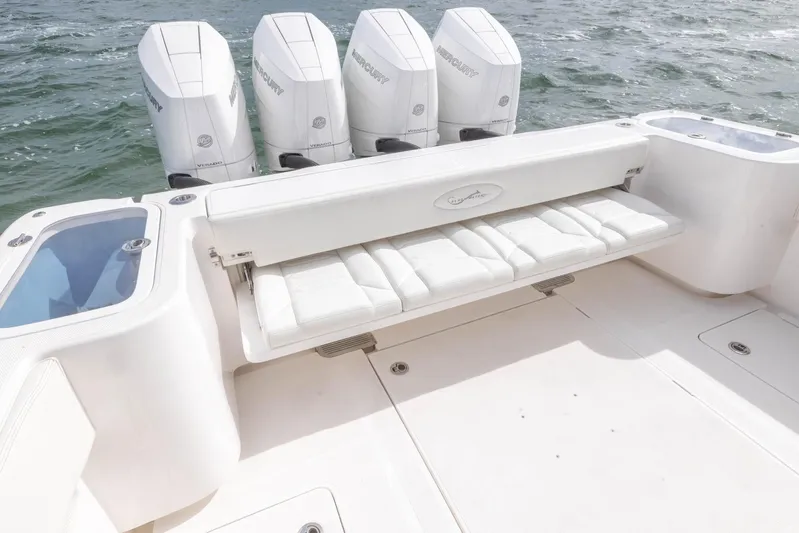 Big B Yacht Photos Pics 2024 Blackwater 43 Sportfish boat with four Mercury engines and cushioned seating.