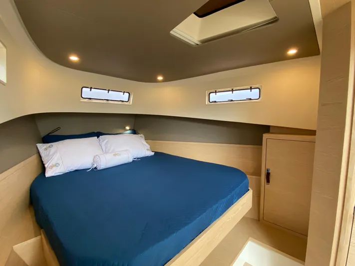  Yacht Photos Pics Luxurious cabin interior of 2024 Solaris Power 40F Open yacht with cozy bed and modern design.