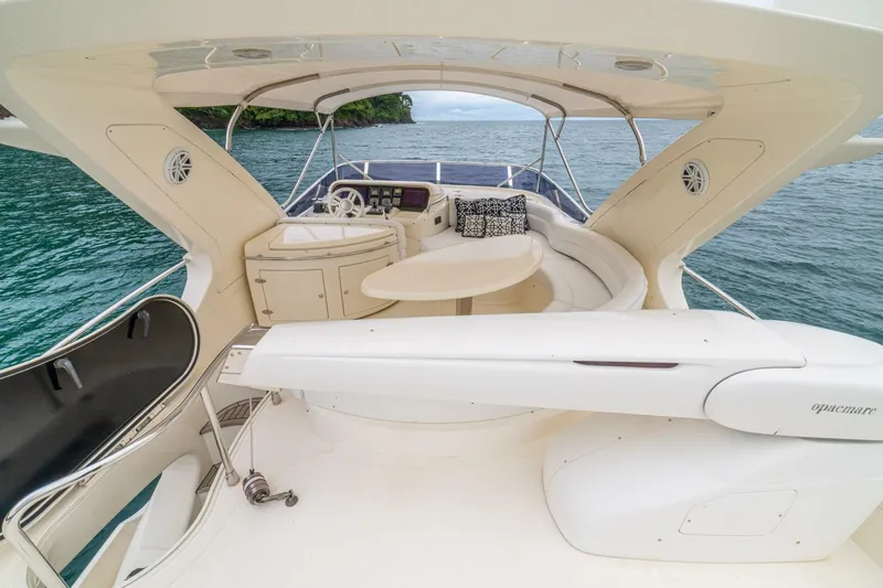 Hakuna Matata Yacht Photos Pics Luxurious 2007 Azimut 55 yacht deck with seating, table, and ocean view.