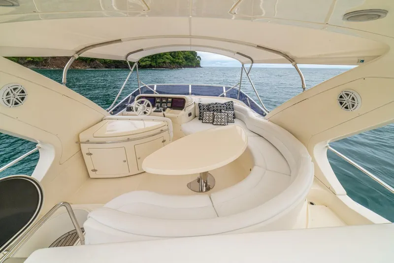 Hakuna Matata Yacht Photos Pics Luxurious 2007 Azimut 55 yacht interior with elegant seating and ocean view.