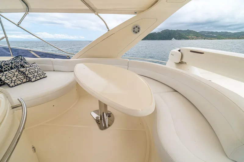 Hakuna Matata Yacht Photos Pics Luxurious seating area on a 2007 Azimut 55 yacht with ocean view.
