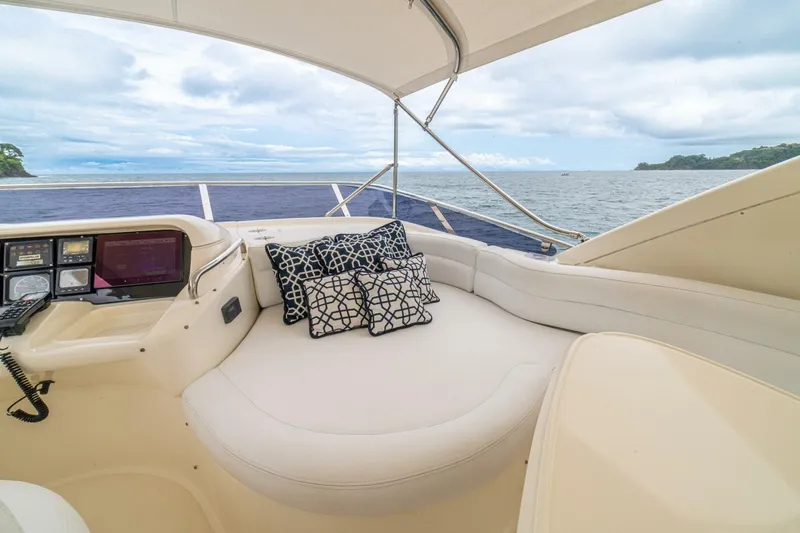 Hakuna Matata Yacht Photos Pics Luxurious 2007 Azimut 55 yacht interior with plush seating and ocean view.