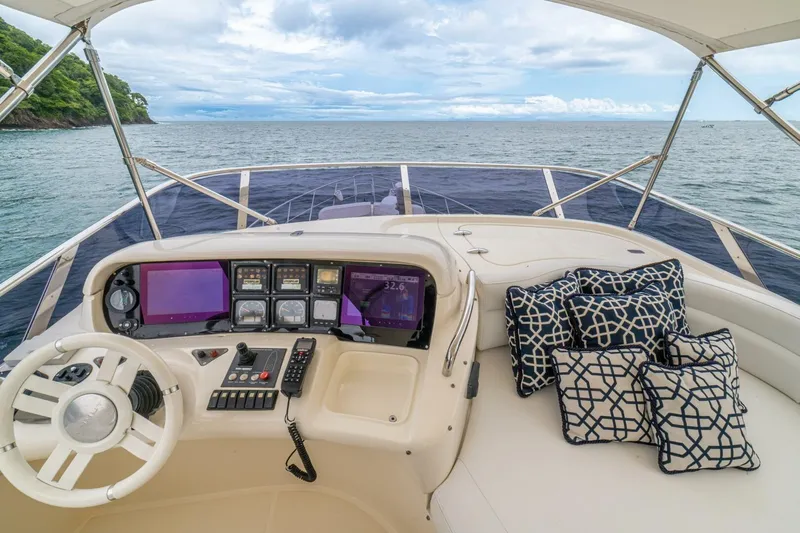 Hakuna Matata Yacht Photos Pics 2007 Azimut 55 yacht helm with ocean view and patterned cushions.