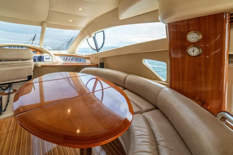 Hakuna Matata Yacht Photos Pics Luxurious interior of a 2007 Azimut 55 yacht with elegant wood and leather seating.