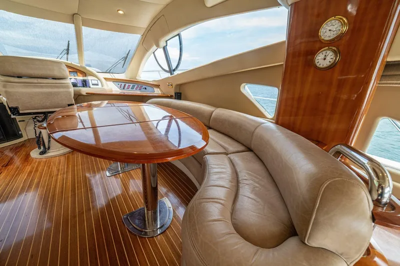 Hakuna Matata Yacht Photos Pics Luxurious interior of a 2007 Azimut 55 yacht with elegant wood and leather finishes.
