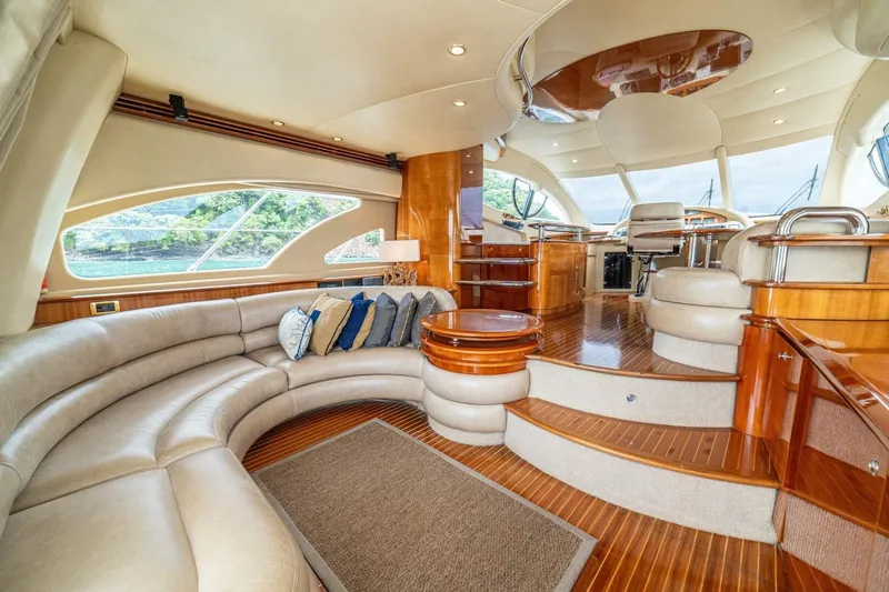 Hakuna Matata Yacht Photos Pics Luxurious interior of 2007 Azimut 55 yacht with elegant seating and polished wood finishes.