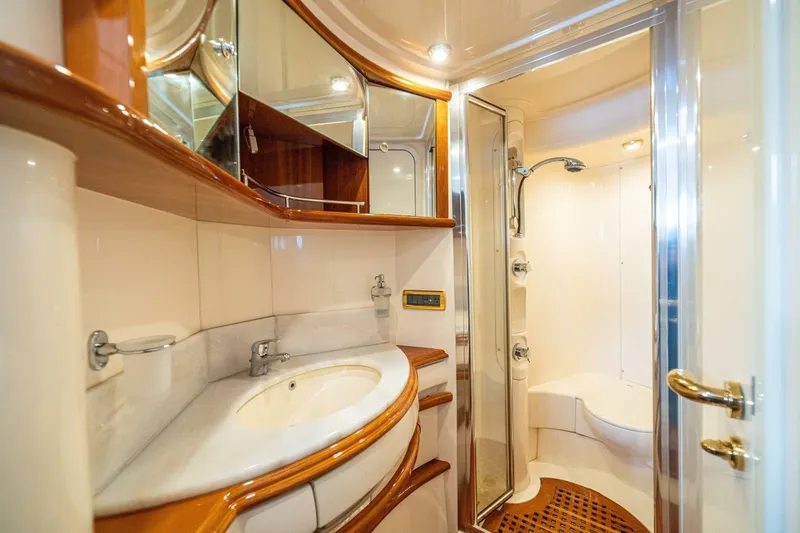 Hakuna Matata Yacht Photos Pics Luxurious bathroom interior of 2007 Azimut 55 yacht with elegant fixtures and shower.