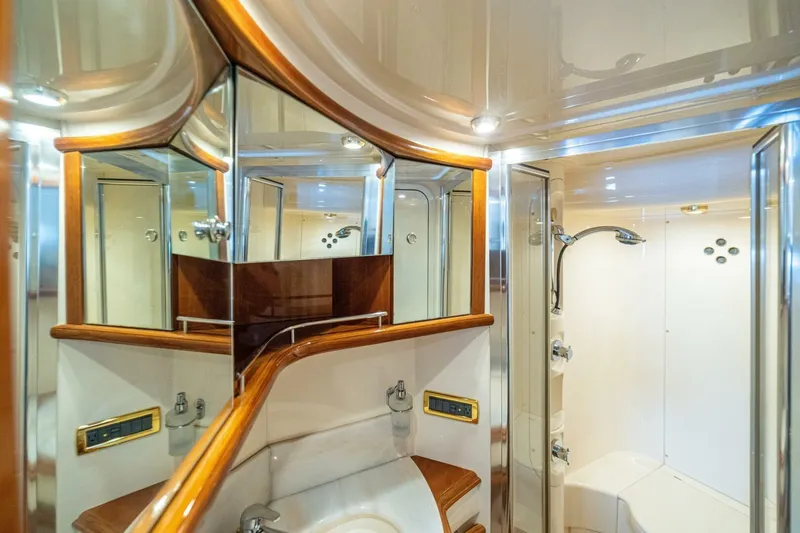 Hakuna Matata Yacht Photos Pics Luxurious bathroom interior of 2007 Azimut 55 yacht with elegant wood accents.