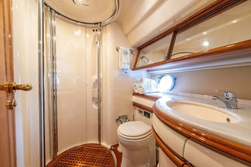 Hakuna Matata Yacht Photos Pics Luxurious bathroom in a 2007 Azimut 55 yacht, featuring elegant fixtures and a compact design.