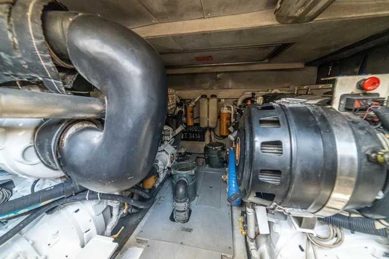 Hakuna Matata Yacht Photos Pics Engine room of a 2007 Azimut 55 yacht, showcasing mechanical components and systems.