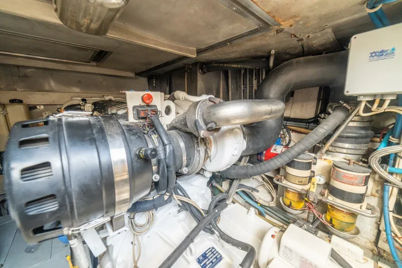 Hakuna Matata Yacht Photos Pics Engine room of a 2007 Azimut 55 yacht, showcasing mechanical components and systems.