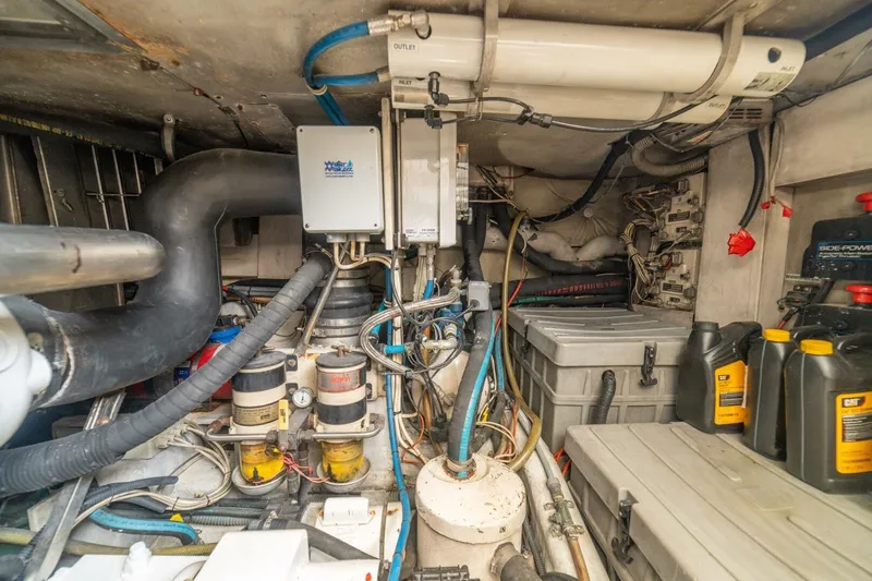 Hakuna Matata Yacht Photos Pics Engine room of a 2007 Azimut 55 yacht with mechanical equipment and storage.