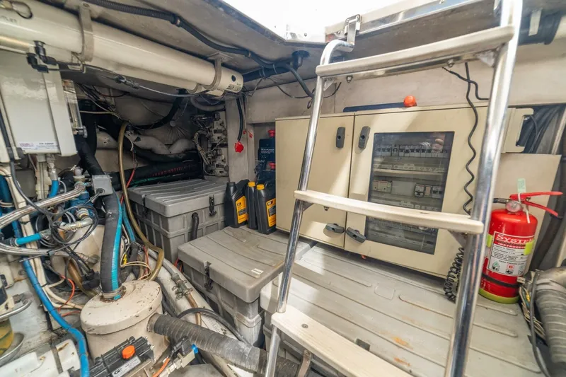 Hakuna Matata Yacht Photos Pics Engine room of a 2007 Azimut 55 yacht with equipment and safety gear.