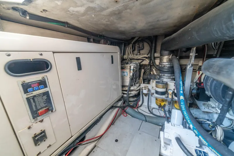 Hakuna Matata Yacht Photos Pics Engine room of a 2007 Azimut 55 yacht, showcasing machinery and wiring.