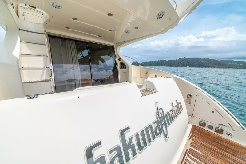 Hakuna Matata Yacht Photos Pics Luxury Azimut 55 yacht from 2007 on serene waters, showcasing elegant design.