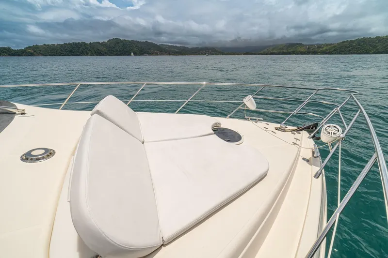 Hakuna Matata Yacht Photos Pics 2007 Azimut 55 yacht deck with ocean view and distant green hills.