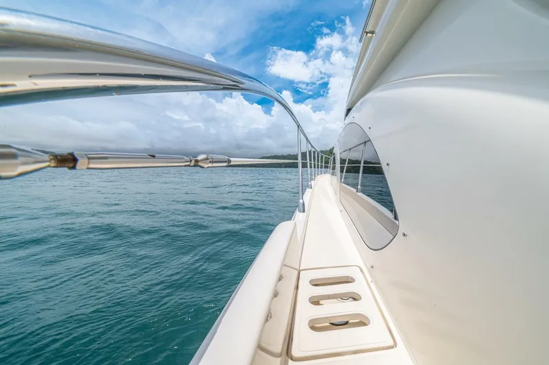 Hakuna Matata Yacht Photos Pics Side view of a 2007 Azimut 55 yacht on open water under a blue sky.