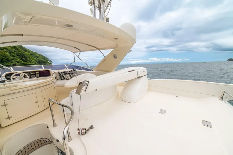 Hakuna Matata Yacht Photos Pics Luxurious 2007 Azimut 55 yacht deck with ocean view and elegant seating area.