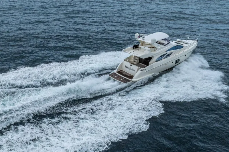 Hakuna Matata Yacht Photos Pics Luxury 2007 Azimut 55 yacht cruising on open sea waters.