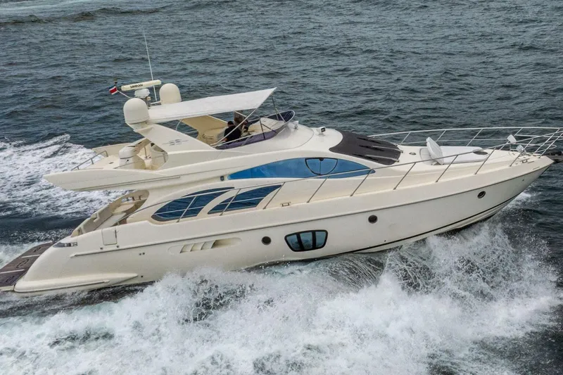 Hakuna Matata Yacht Photos Pics 2007 Azimut 55 yacht cruising on open water, showcasing sleek design and luxury features.