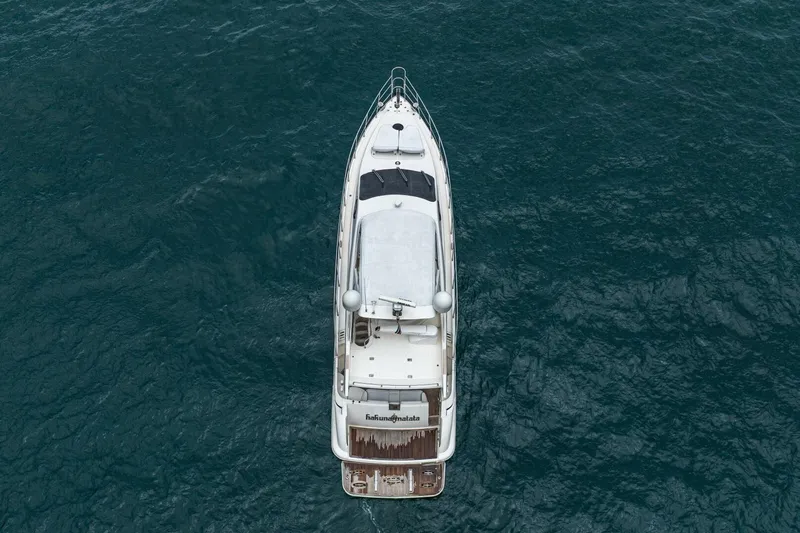 Hakuna Matata Yacht Photos Pics Aerial view of 2007 Azimut 55 yacht on open water.