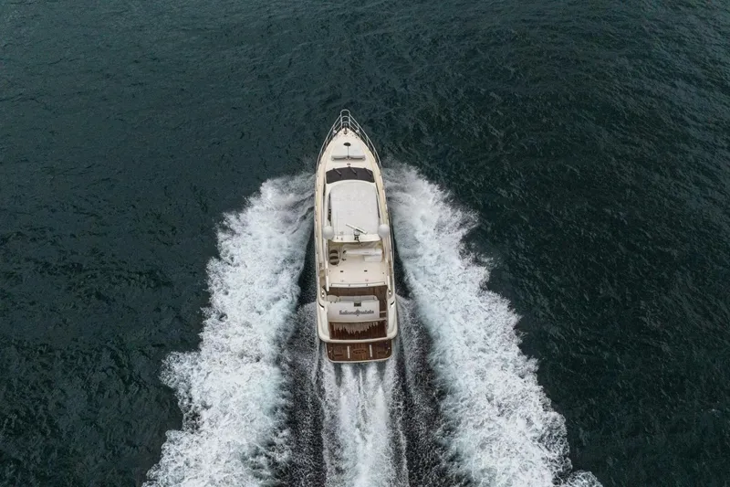 Hakuna Matata Yacht Photos Pics Aerial view of 2007 Azimut 55 yacht cruising on open water.