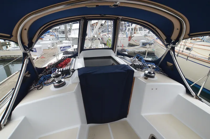 Tahlequah Yacht Photos Pics Cockpit of 2020 Tartan 365 sailboat with blue canopy and marina view.