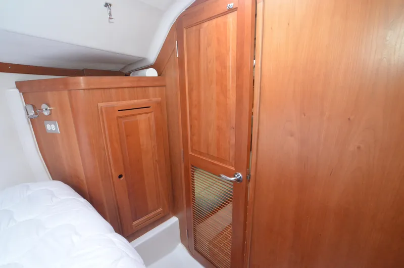 Tahlequah Yacht Photos Pics Interior of 2020 Tartan 365 yacht with wooden cabinetry and door.