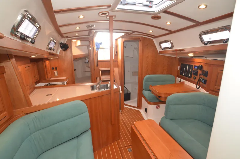 Tahlequah Yacht Photos Pics Luxurious 2020 Tartan 365 yacht interior with wood finish and plush seating.