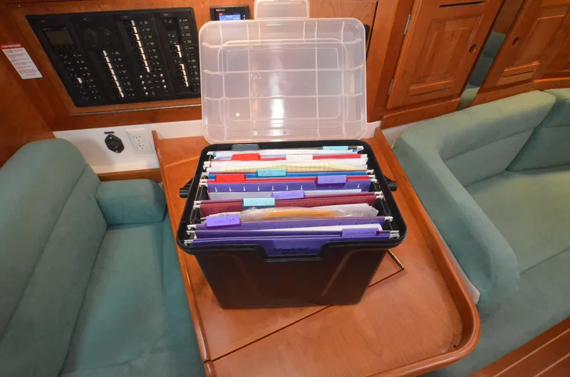 Tahlequah Yacht Photos Pics Filing box with documents on a Tartan 365 yacht's wooden table, 2020 model.