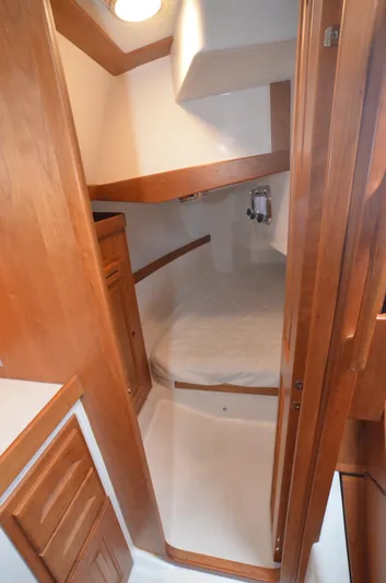 Tahlequah Yacht Photos Pics Cozy cabin interior of 2020 Tartan 365 sailboat with wooden finish and compact bed.